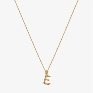 Detail of gold S925 silver necklace with textured initial E pendant and small diamonds