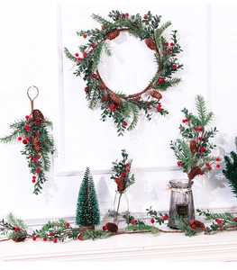 Detailed Christmas wreath with pine needles, red berries, and natural pine cones