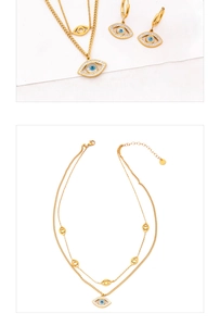 Macro view of gold evil eye jewelry set with blue accents and sparkling crystal pavé