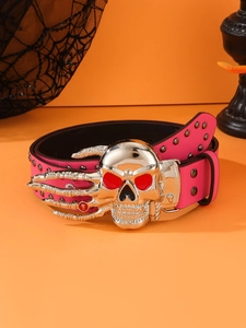 Pink punk leather belt detail with large silver skull buckle and metal rivet accents
