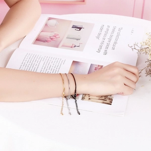 Three-piece stainless steel snake chain bracelet set in gold, silver, and black finish