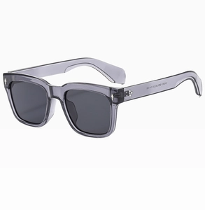 Macro shot of retro rectangle thick frame sunglasses with iconic metal arrow rivets