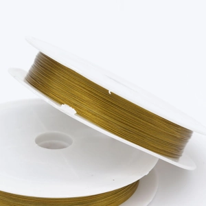 Golden steel wire spools for jewelry making and DIY bead stringing material