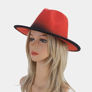 Detail view of red and black gradient wool fedora hat on mannequin head