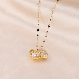 Elegant heart locket necklace with pavé zircon stones and a pearl inside on gold chain