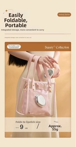 Detail of pink portable folding comb with mirror showing compact 9cm size and 55g weight