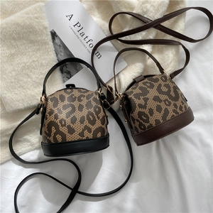 Chic leopard print bucket handbags in black and brown styles with golden hardware
