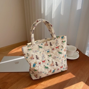 Quilted cotton tote bag with cartoon dog patterns and a simple wish brand label