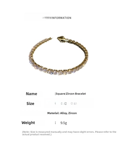 Macro shot of 16.7cm gold chain bracelet with square cut cubic zirconia stones