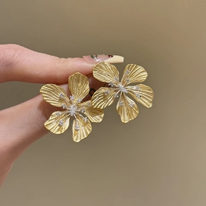 Golden flower earrings with silver needles and crystals in a five-petal floral design