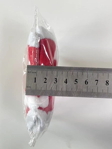 Detail showing measurement of the mini Christmas hat width at approximately 5.5 cm