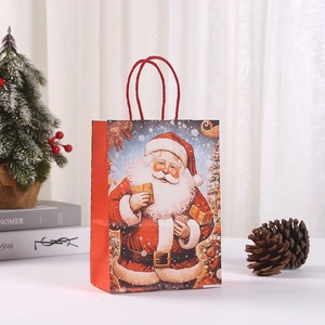 Festive Christmas Santa Claus kraft paper gift bag with red handles for holiday parties