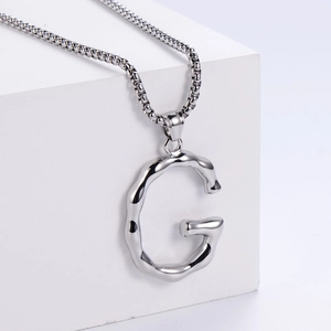 Polished silver stainless steel necklace with melting texture letter G pendant on box chain