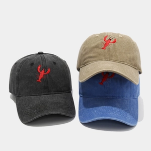 Vintage washed cotton baseball caps with lobster embroidery in black, khaki, and blue