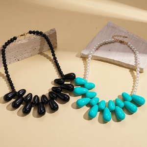 Exaggerated acrylic bead teardrop necklaces in black and turquoise with pearl details