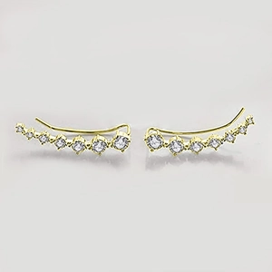Detail of gold curved crawler earrings featuring seven sparkling white gradient zircons