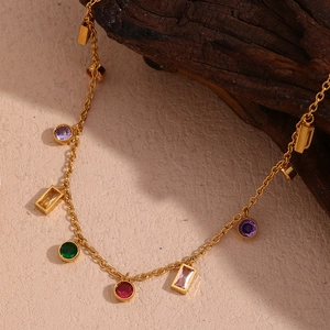 Detail of 18K gold-plated necklace with colorful round and rectangle zircon stones
