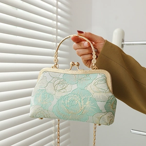 Elegant mint green embroidered cheongsam handbag with gold frame and chain strap