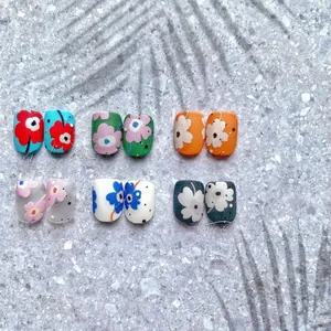 Detailed view of floral nail art stickers with hand-painted patterns on matte finish