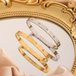 Titanium steel bangle with zircon star engraving in gold and silver mirror finish