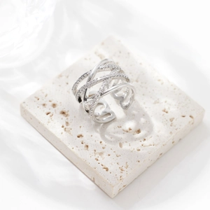 Crossed multi-layer stainless steel ring with micro-pave cubic zirconia on cream stone