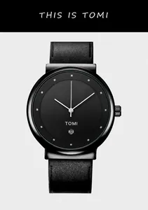 Macro detail of minimalist black watch face with silver markers and date window