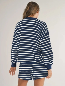 Back view of a striped long-sleeve T-shirt and shorts two-piece casual set for women