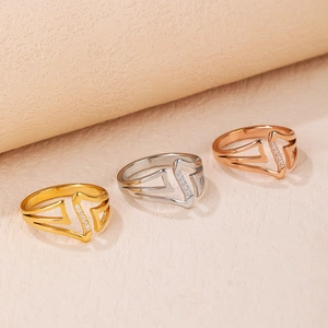 Three multi-layer V-letter rings in gold, silver, and rose gold with zircon stones