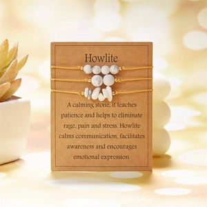 Detailed view of Howlite crystal healing bracelets with informational display card