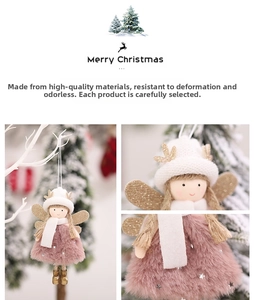 Detailed view of plush Christmas angel ornament with pink fur skirt and gold wings