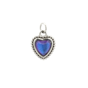 Detail of a 18K gold plated copper heart pendant with blue purple gradient inlay