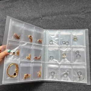 Clear PVC jewelry organizer book with multiple sealed anti-oxidation storage pockets