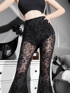 Gothic high waist black lace flare pants with cross pattern shown in a moody indoor setting