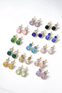 Close-up of assorted colorful square crystal drop earrings in stainless steel setting