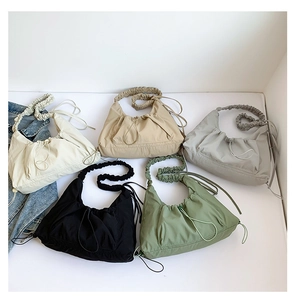 Detailed collection of pleated canvas tote bags in five colors with drawstring design