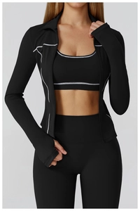 Detail of contrast stitching on women's athletic yoga jacket and fitness set