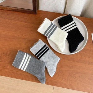 Set of four cotton striped crew socks in black, white, and grey for women