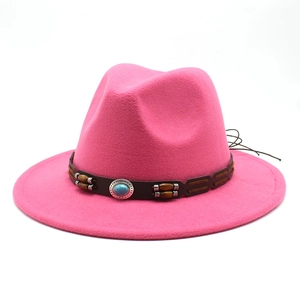 Detailed view of hot pink felt fedora featuring wood beads and turquoise stone inlay