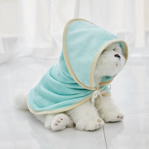 Detailed texture of light blue microfiber pet bathrobe with soft hood and yellow trim
