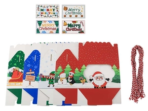 Flat lay of Christmas DIY gift box set with festive cartoon patterns and cotton twine