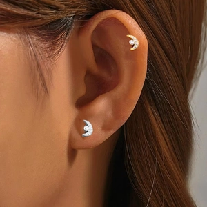 G23 titanium crescent moon stud earrings with sparkling cubic zirconia on model