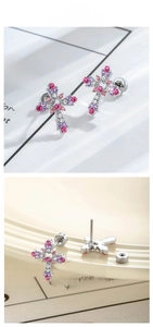 Detail of cross stud earring with pink and purple zircon stones and screw flat back