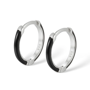 Detailed macro view of S925 sterling silver hoop earrings with black enamel inlay