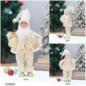 Front, side, and back views of an elegant cream and gold Santa Claus holiday figurine