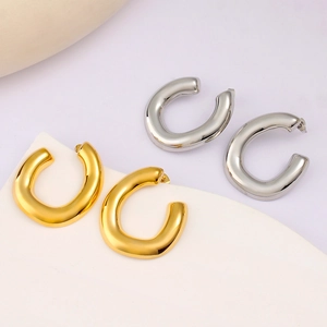 Minimalist C-shaped thick hoop earrings in 18K gold and silver stainless steel