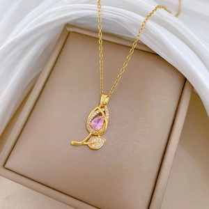 Pink tulip flower pendant necklace in gold finish with sparkling cubic zirconia crystals