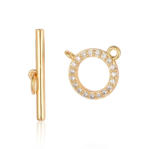 Détail de fermoirs à bascule OT dorés avec pavage de zircons pour bijoux