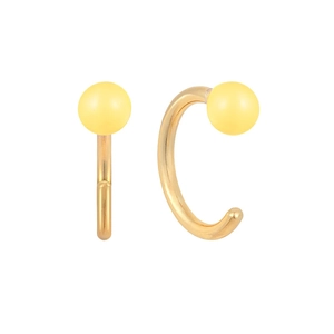 Detailed view of C-shaped gold-plated silver earrings with pale yellow bead accents