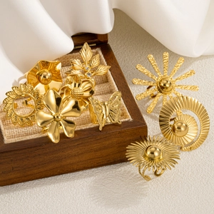 Eight-piece gold vintage ring set featuring flower and geometric butterfly designs