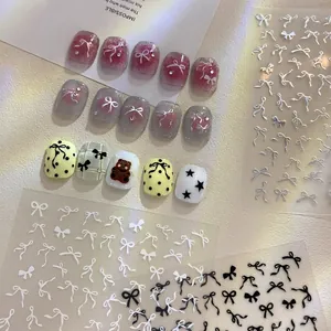 Elegant 3D bow nail stickers and gradient press-on nails with shiny metallic accents